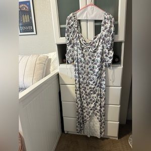 White floral print with blue and pink flowers